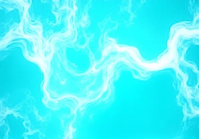 Abstract top-down view of turquoise ocean waves meeting white sand